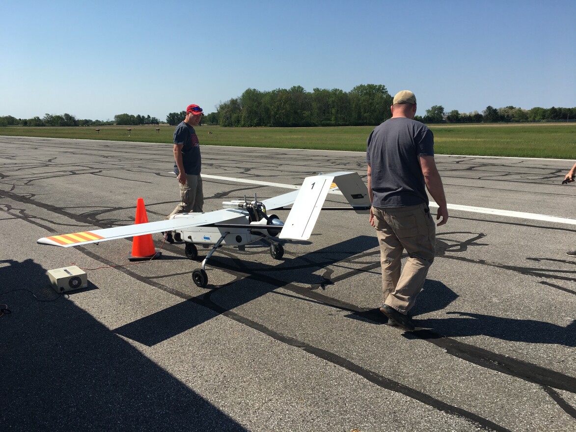 Air Force Research Lab crew does pre-flight checks for the Bat 4 UAV. With FAA approval it will be able to fly beyond visual line of sight with a new radar in Springfield, Ohio.